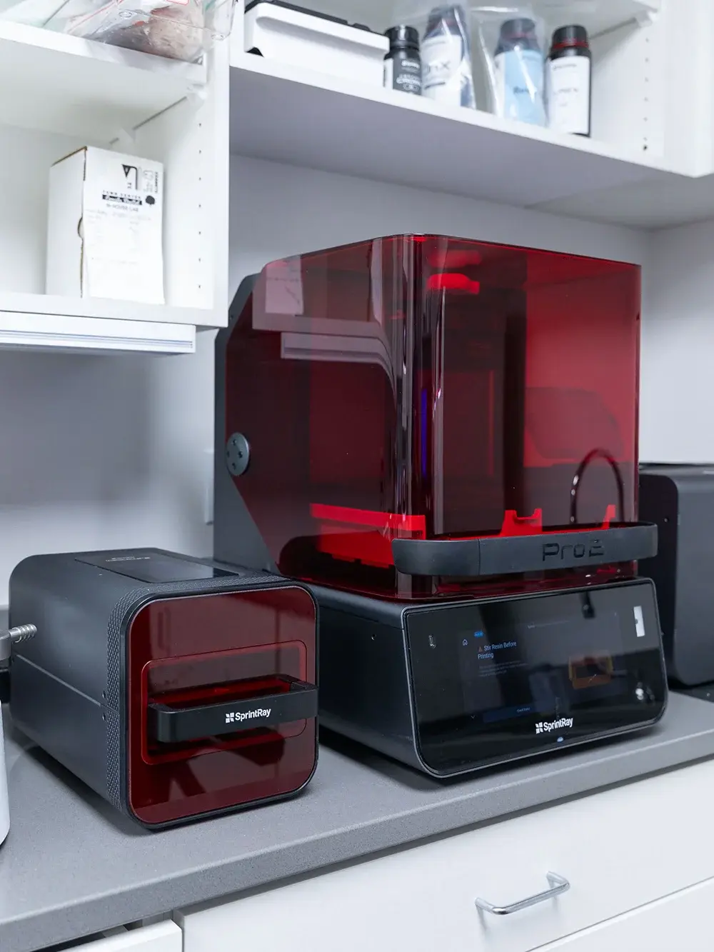 Advanced 3D dental laboratory equipment including SprintRay printers for digital dental restorations.