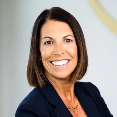 Dr. Lori Thomas, dentist at Flint dental practice, smiling professionally.