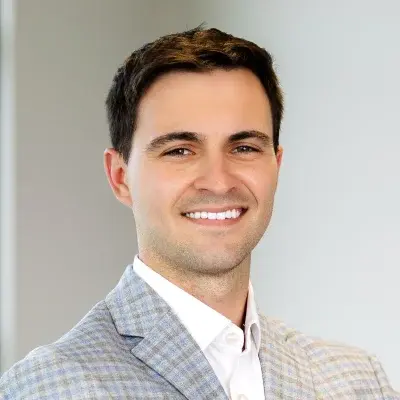 Dr. Spencer Wills, dentist at Flint dental practice, smiling in professional portrait.