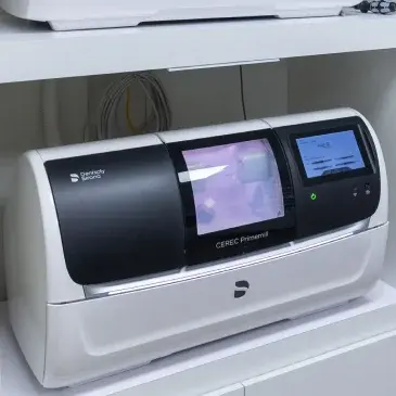 CEREC milling machine for same-day dental crowns and bridges in Flint, Michigan.