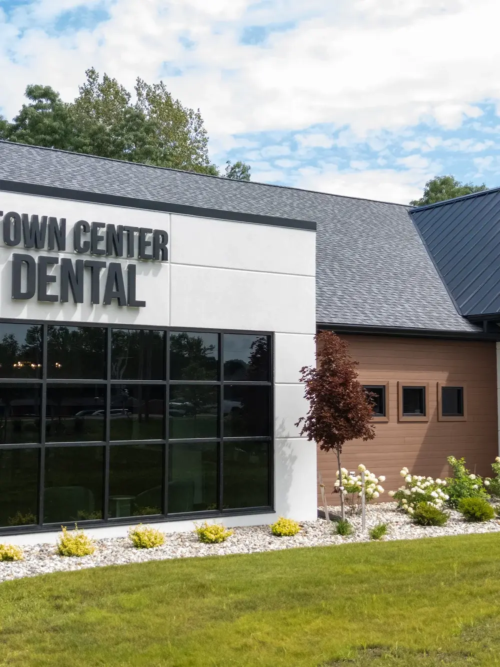 Town Center Dental clinic exterior featuring modern white and brick facade with large windows at 4500 Town Center Parkway, F.